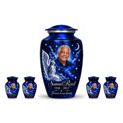 One blue adult angel urn and four keepsakes with a kneeling angel, stars and crescent moon on white.
