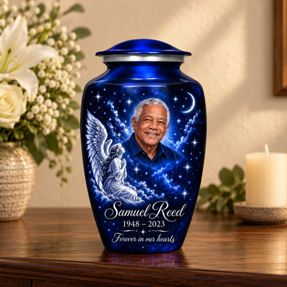 Blue adult angel urn with a kneeling angel, stars and crescent moon on a memorial console.