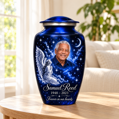 Blue adult angel urn with a kneeling angel, stars and crescent moon in a sunlit home.