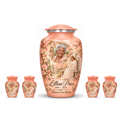 One pink adult angel urn and four matching keepsake urns with sample portraits and inscriptions on white.