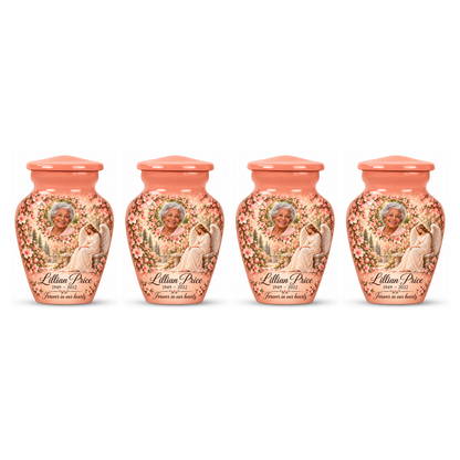 Four matching pink angel keepsake urns with sample portraits and inscriptions on white.