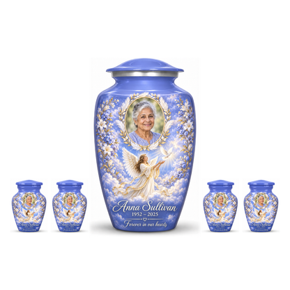 One blue adult angel urn and four matching keepsake urns with sample portraits and inscriptions on white.