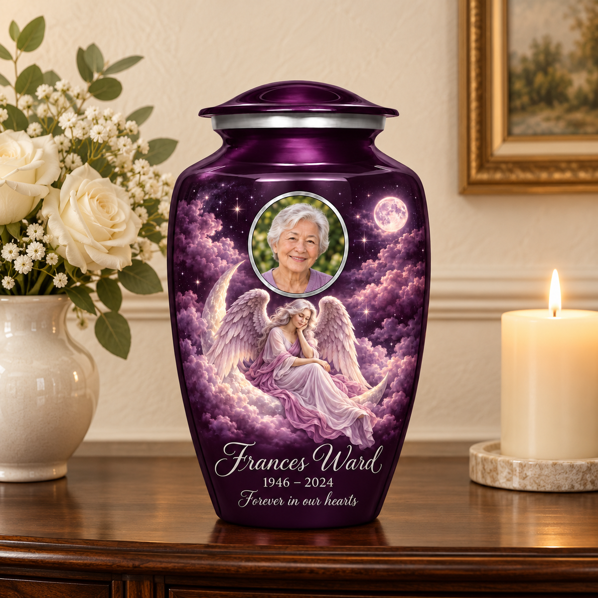 Purple adult urn with a seated angel on a crescent cloud, moonlit sky and an oval sample portrait frame, displayed on a memorial console.