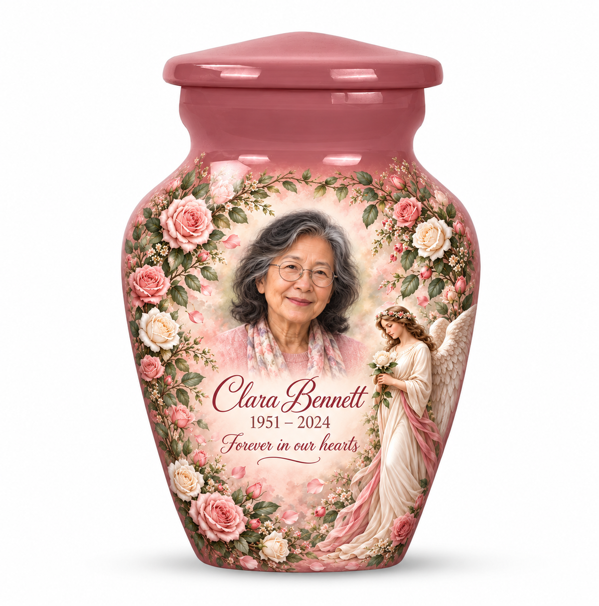 One pink angel keepsake urn with an angel holding a white rose amid pink flowers and sample photo personalization.