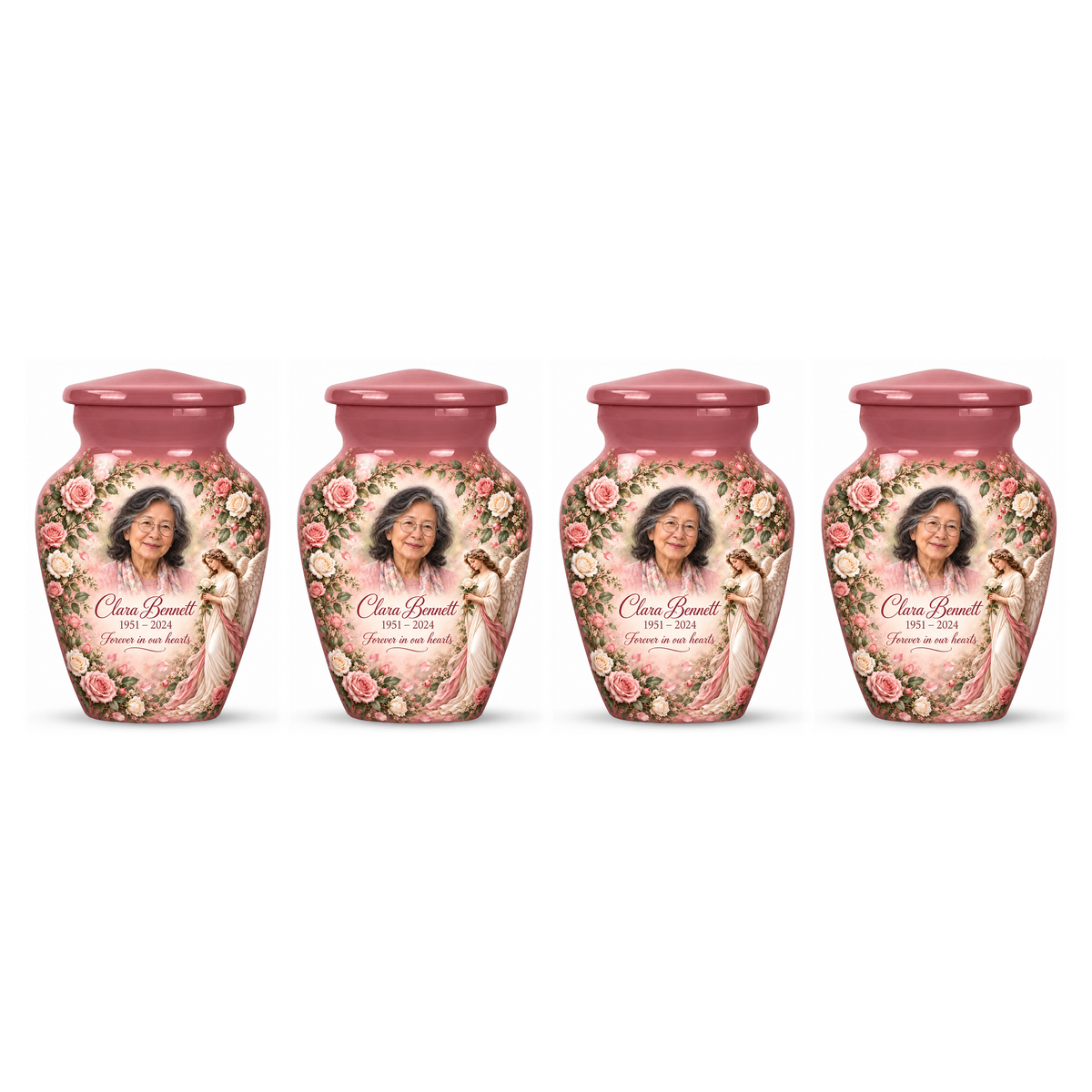 Four matching pink angel keepsake urns with an angel holding a white rose amid pink flowers on white.