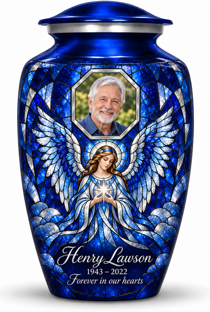 Blue adult urn with a star holding angel in mosaic inspired artwork and a geometric sample portrait frame, name, dates and tribute.