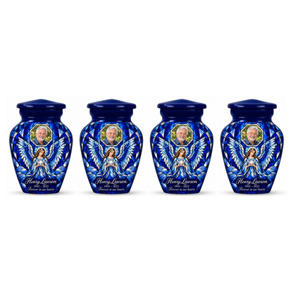 Four matching blue angel keepsake urns with sample photo personalization on a white background.
